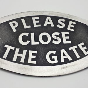 A solid aluminium gate sign reading "Please flos the gate' designed to last and remain clear. Silver coloured text against black background to stand out.