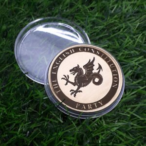 Challenge coin in plastic case for the English Constitution Party, with their name, a Wyvern on the front and the Constitution Acts on the rear.