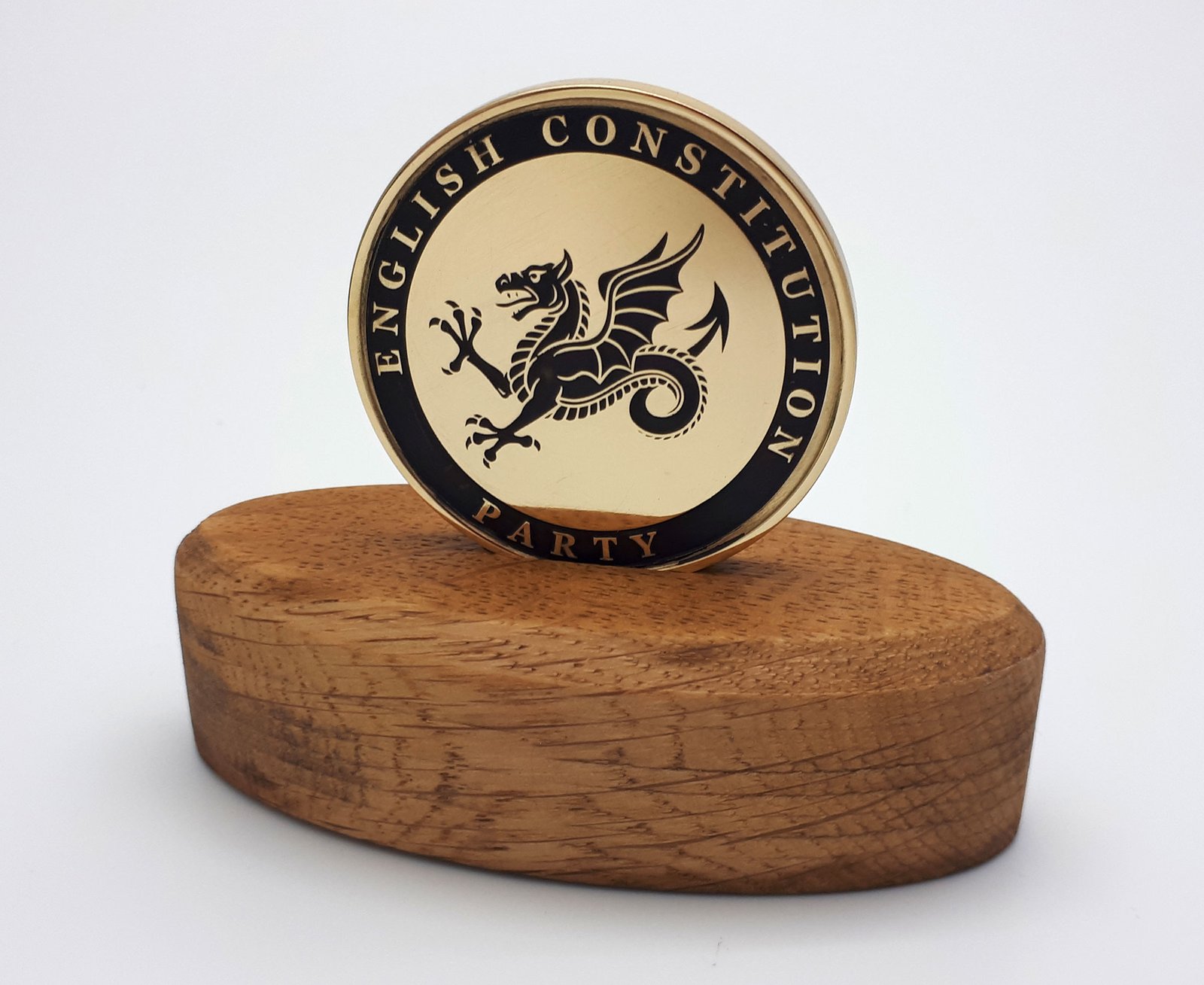 english constitution party challenge coin displayed on an solid English oak stand